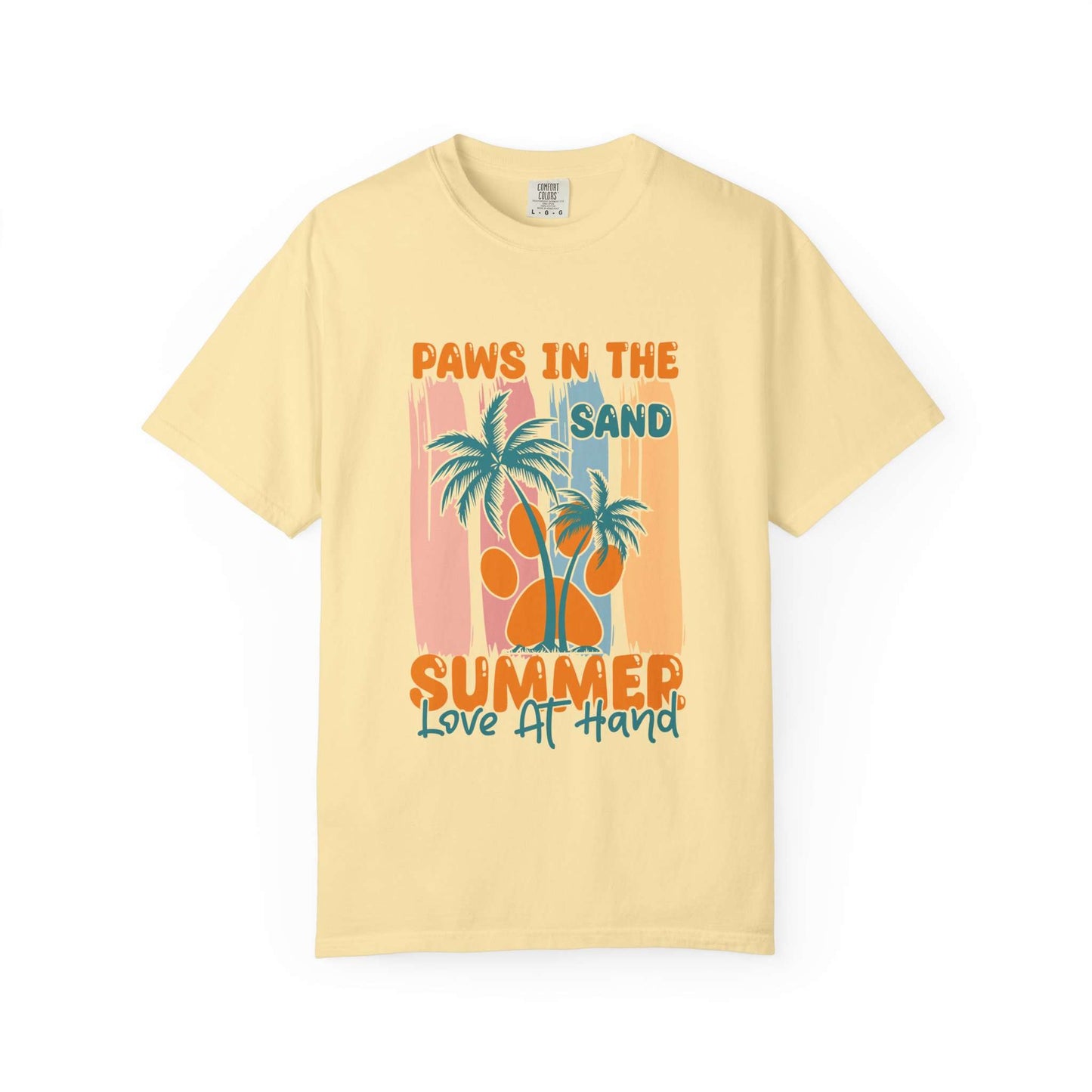 A pale yellow short-sleeve t-shirt with a retro-style graphic on the front featuring palm trees, a large orange paw print, and the text 'PAWS IN THE SAND SUMMER Love IT HAND'. Buy Paws in the Sand: A Summer Love Graphic T-Shirt Casual Wear for Sale Online Shop Paws in the Sand: A Summer Love Graphic T-Shirt Casual Wear for a relaxed, beach-ready look celebrating comfort and style.