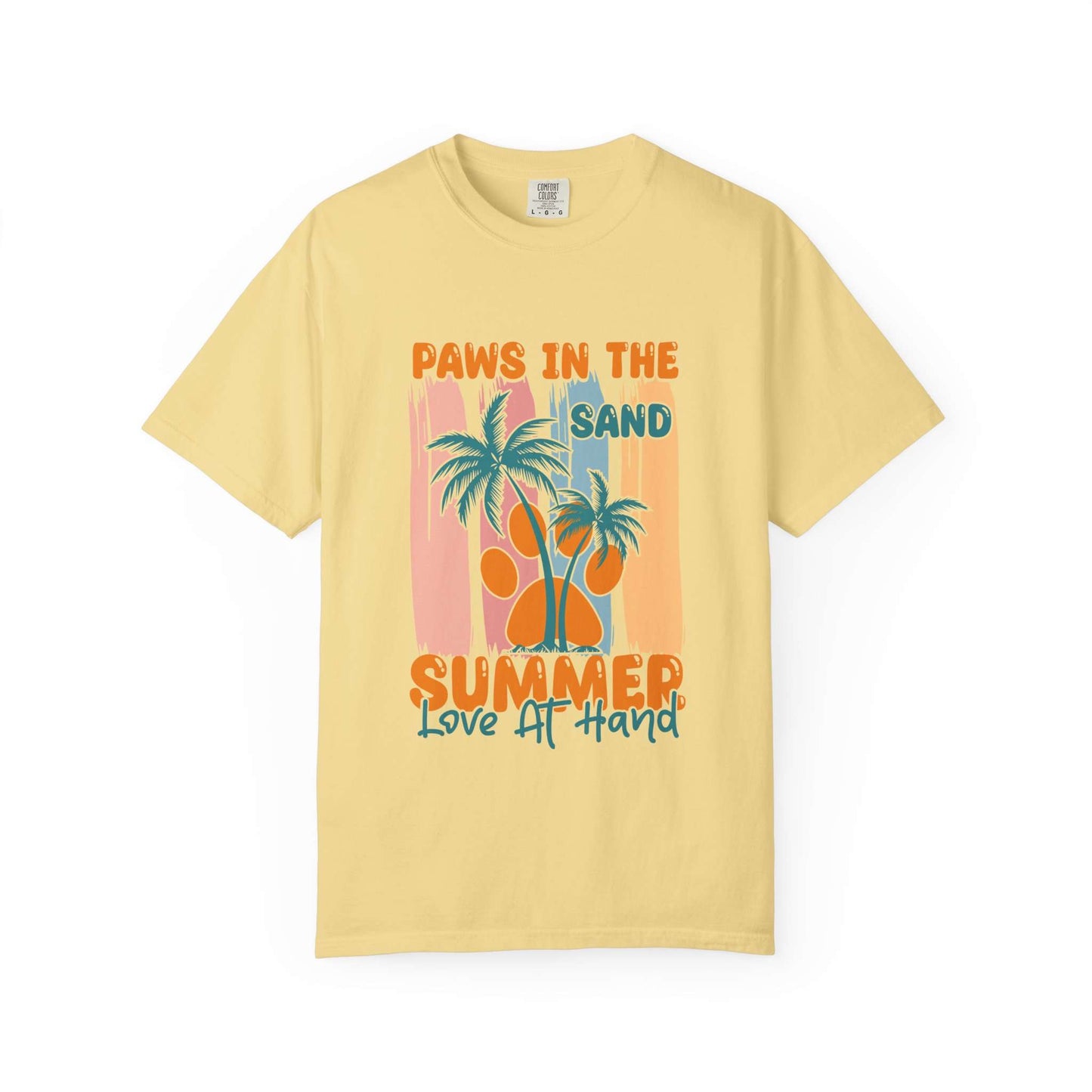 A pale yellow short-sleeve t-shirt with a retro-style graphic on the front featuring palm trees, an orange paw print, and the text 'PAWS IN THE SAND SUMMER Love AT HAND'. Buy Paws in the Sand: A Summer Love Graphic T-Shirt Casual Wear for Sale Online Shop Paws in the Sand: A Summer Love Graphic T-Shirt Casual Wear for a relaxed, beach-ready look celebrating comfort and style.