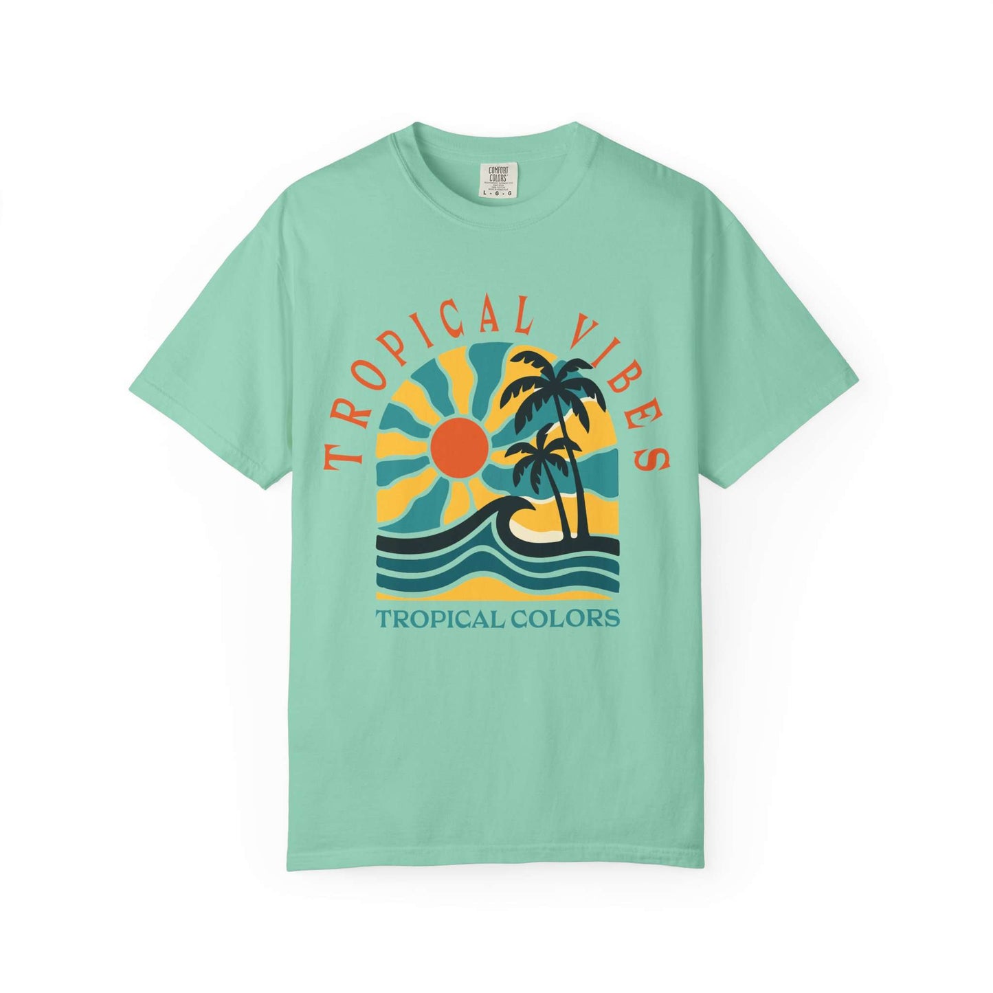 A mint green short-sleeve t-shirt with a retro tropical graphic on the chest. The graphic features a yellow and blue sun, two black palm trees, and blue waves, with the text 'TROPICAL VIBES' arched above and 'TROPICAL COLORS' printed below. Tropical Vibes Summer Graphic Print T-Shirt Shop Tropical Vibes Summer Beach Graphic T-Shirt Casual Wear for breezy comfort, bold island-inspired style, and effortless sunny-day looks.