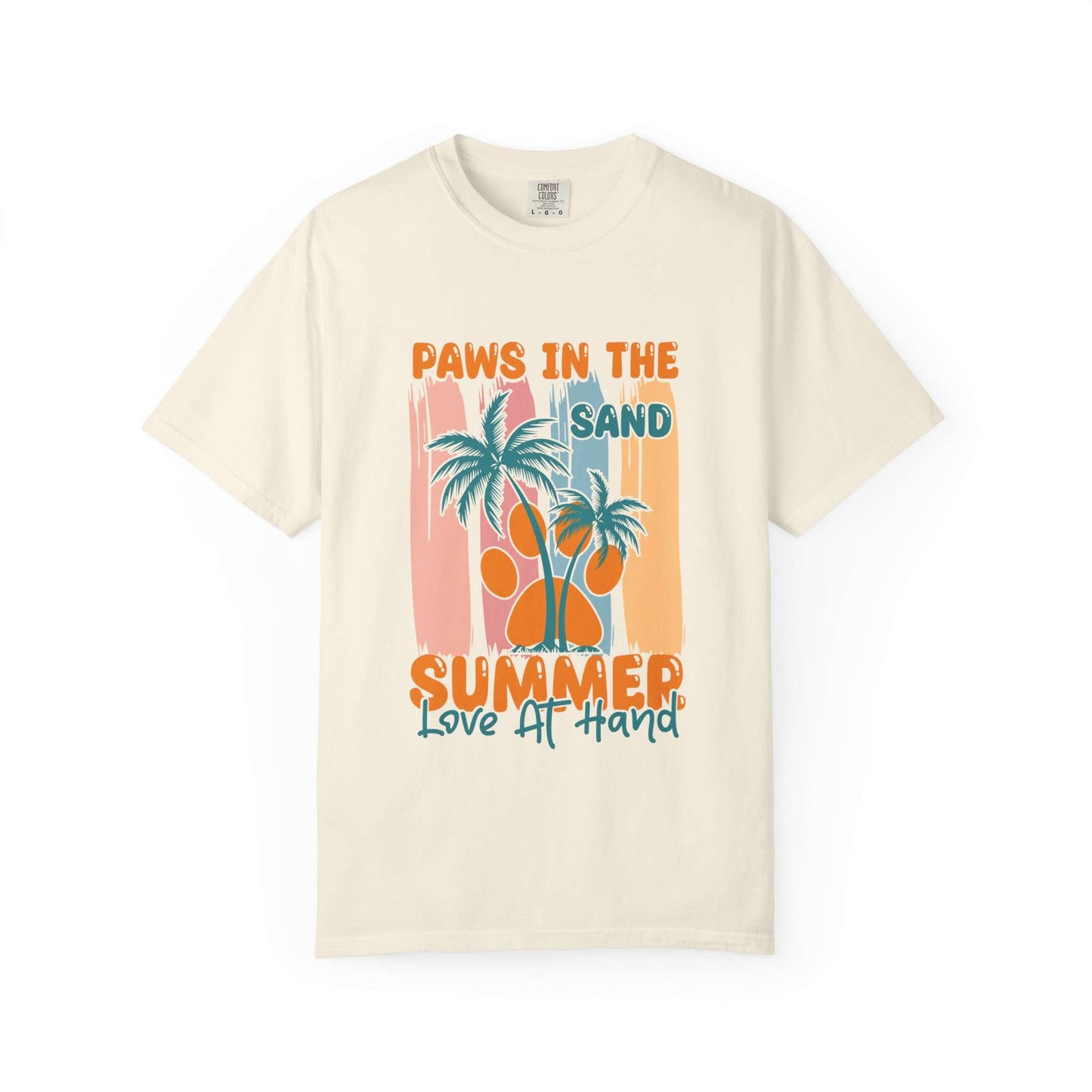 An off-white short-sleeve t-shirt with a retro-style graphic on the front featuring palm trees, a paw print, and the text 'PAWS IN THE SAND SUMMER Love AT HAND' in orange and teal. Buy Paws in the Sand: A Summer Love Graphic T-Shirt Casual Wear for Sale Online Shop Paws in the Sand: A Summer Love Graphic T-Shirt Casual Wear for a relaxed, beach-ready look celebrating comfort and style.