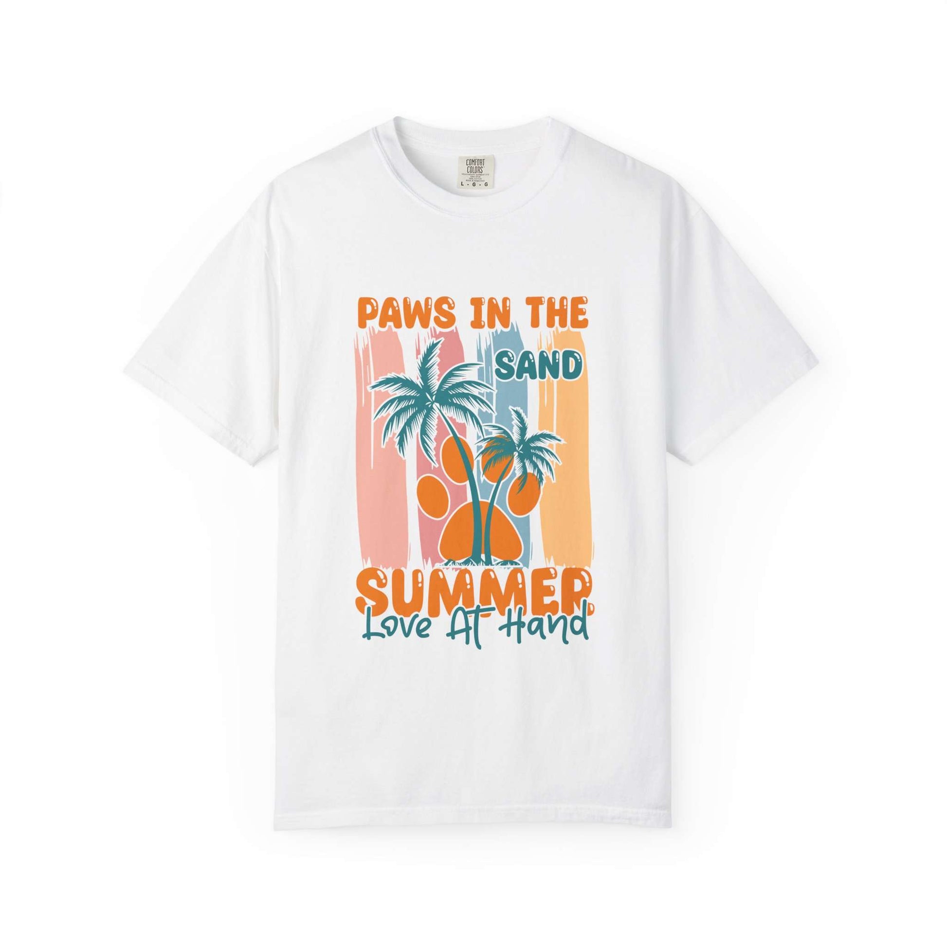 A white short-sleeve crewneck t-shirt featuring a retro-style summer graphic with palm trees, a paw print, and the text 'PAWS IN THE SAND SUMMER Love IT HAND' in orange and teal. Buy Paws in the Sand: A Summer Love Graphic T-Shirt Casual Wear for Sale Online Shop Paws in the Sand: A Summer Love Graphic T-Shirt Casual Wear for a relaxed, beach-ready look celebrating comfort and style.