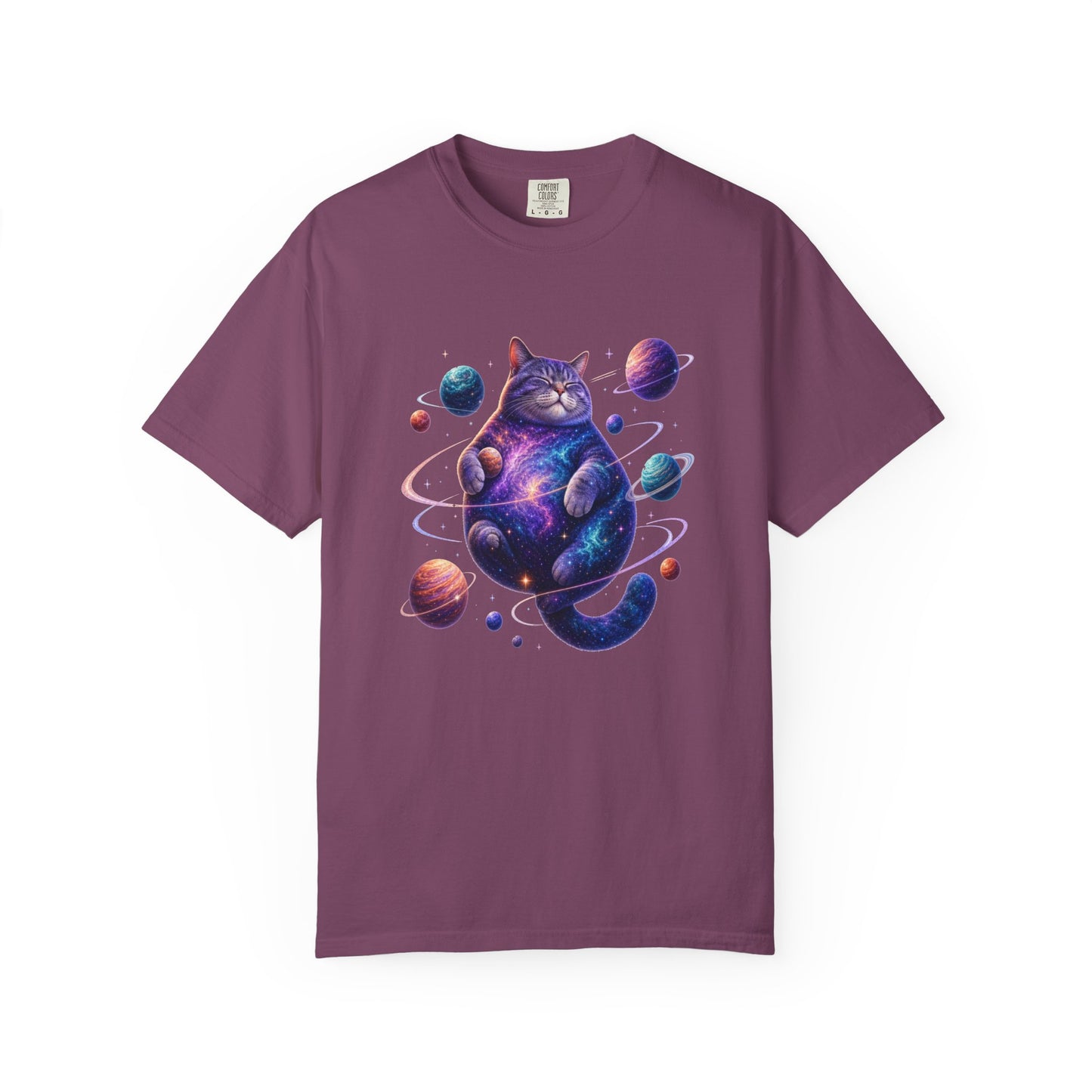 A short-sleeve crewneck t-shirt in a dusty plum purple color, featuring a colorful graphic print of a cosmic cat surrounded by planets and stars on the front. Adorable Celestial Feline: Space-Themed Cat T-Shirt for Casual Wear