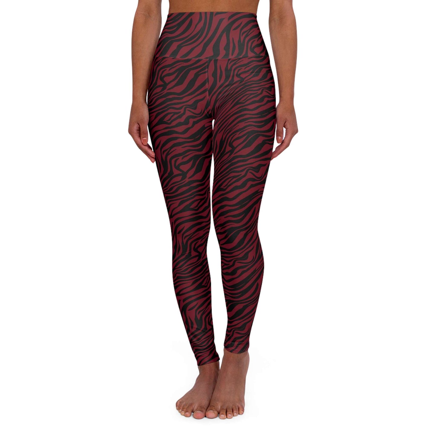 A model wearing high-waisted leggings with a red and black wavy zebra-like pattern, shown from the waist down on a plain white background. Bold Red Zebra Print High Waisted Yoga Leggings Activewear