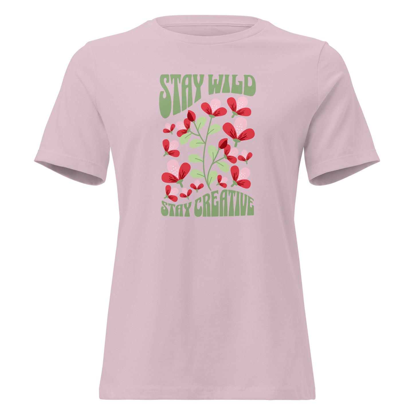 A light pink short-sleeve crewneck t-shirt featuring a retro-style graphic on the front with red flowers and green text reading 'STAY WILD' and 'STAY CREATIVE'. Bold Stay Wild Stay Creative Women's Relaxed T-Shirt Casual Wear