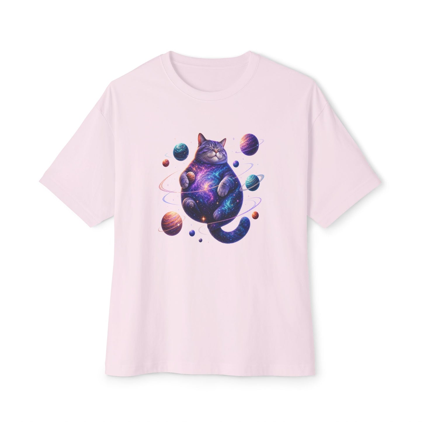 A light pink short-sleeve crewneck t-shirt featuring a colorful graphic of a cat with a galaxy print, surrounded by planets, on a solid white background. Celestial Feline Funny Cosmic Cat Unisex Oversized Boxy T-Shirt Casual Wear
