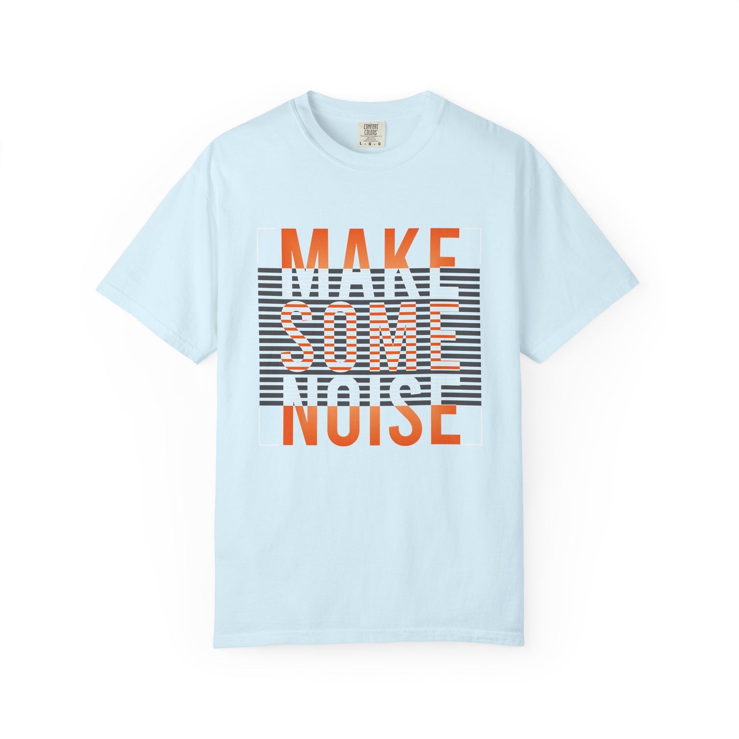 A light blue short-sleeve t-shirt with a graphic print on the front reading 'MAKE SOME NOISE' in orange and white over a black-and-white striped background, displayed on a clean white background. Comfortable Make Some Noise Slogan Typography Graphic T-Shirt for Casual Wear