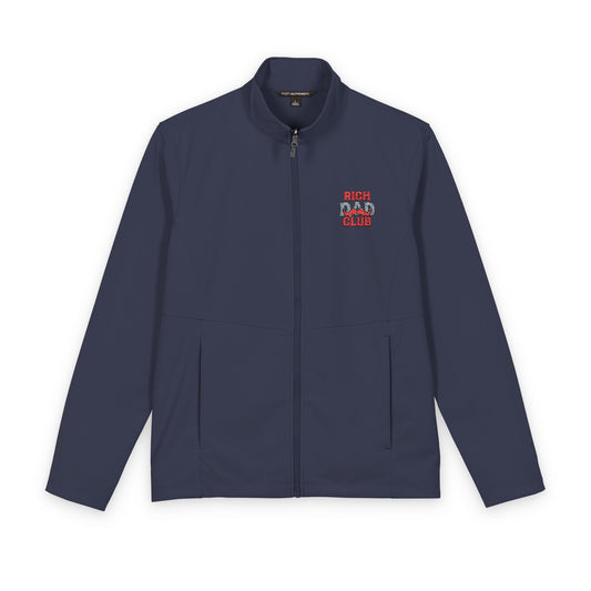 A navy blue zip-up jacket with a stand collar, featuring a small embroidered graphic on the left chest that reads 'RICH DAD CLUB' in red and white. The jacket is displayed flat against a solid white background.