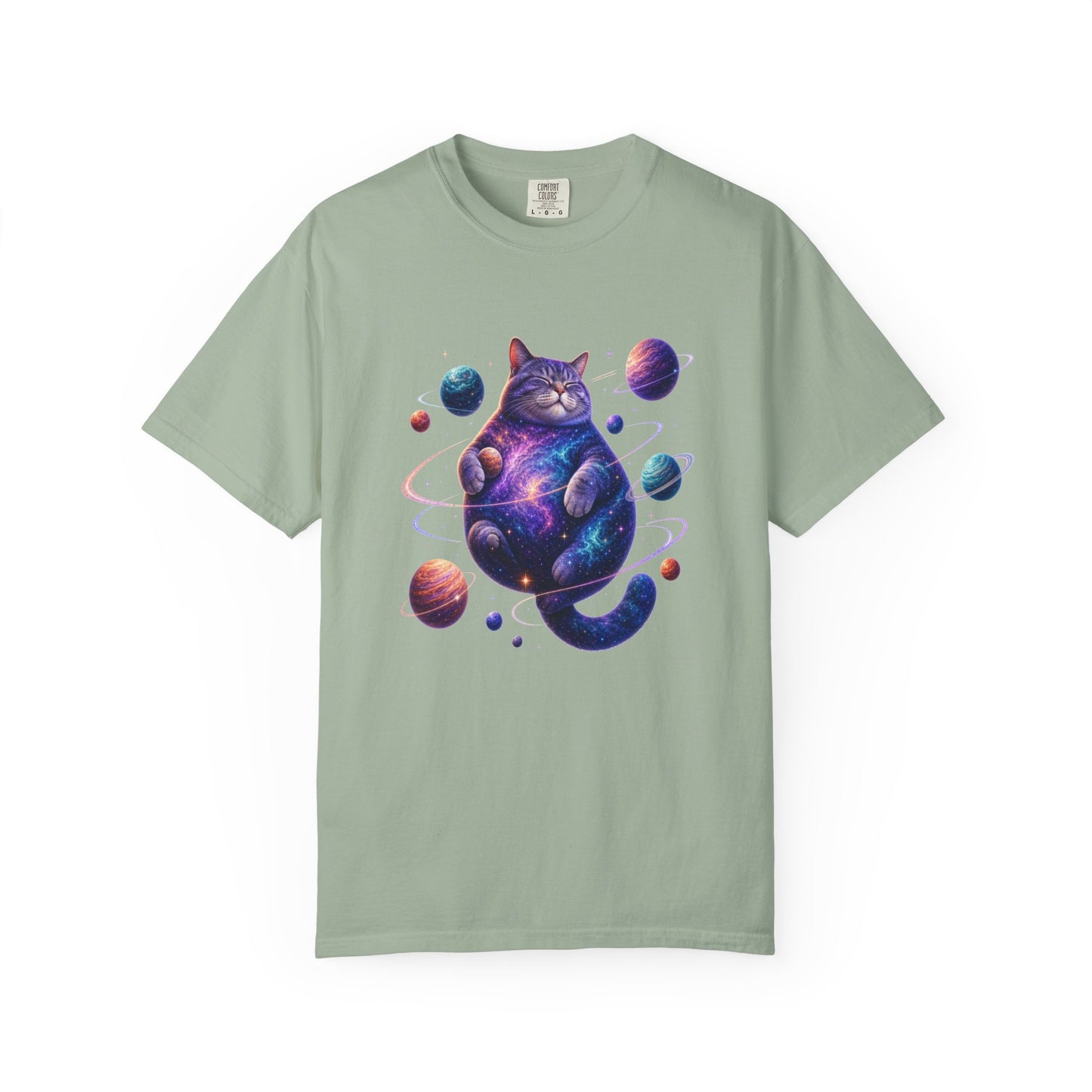 A sage green short-sleeve t-shirt with a colorful graphic of a cosmic, galaxy-patterned cat sitting among small planets, displayed on a clean white background. Cool Celestial Feline: Space-Themed Cat T-Shirt for Casual Wear