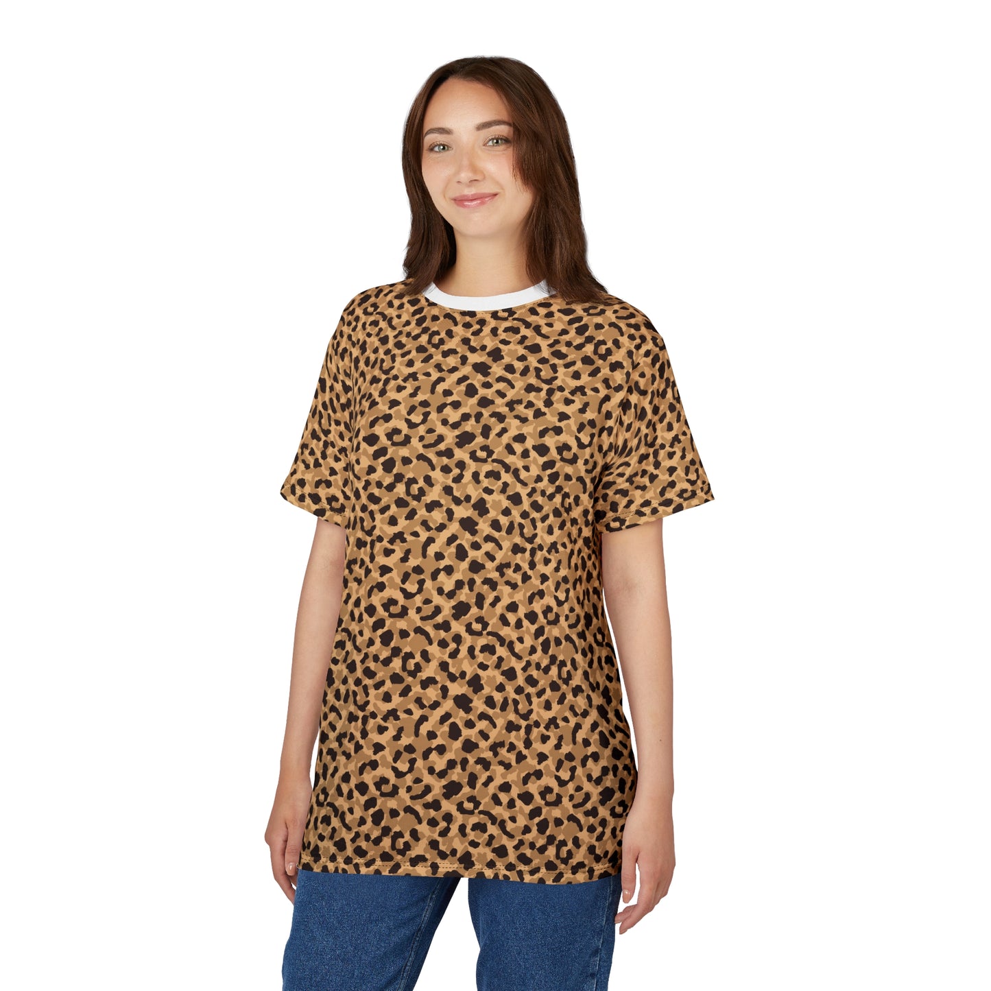 A woman modeling a short-sleeve crewneck t-shirt with a tan and black leopard print pattern, paired with blue jeans, against a plain white background. Cute Bold Brown Leopard Print T-Shirt for Casual Wear