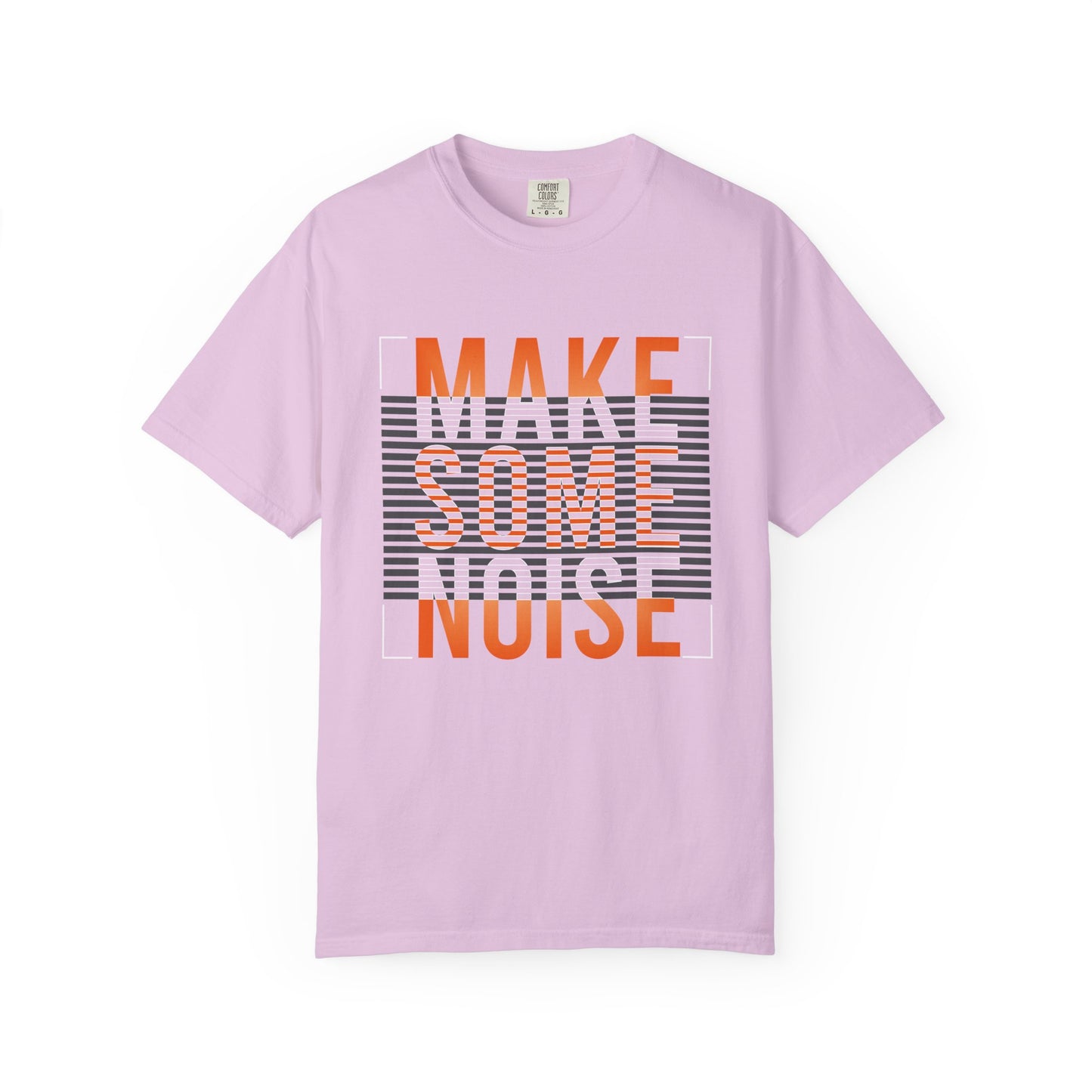 A light purple short-sleeve t-shirt with a graphic on the front reading 'MAKE SOME NOISE' in orange and white over a gray striped background, displayed on a clean white background. Essential Make Some Noise Slogan Typography Graphic T-Shirt Casual Wear