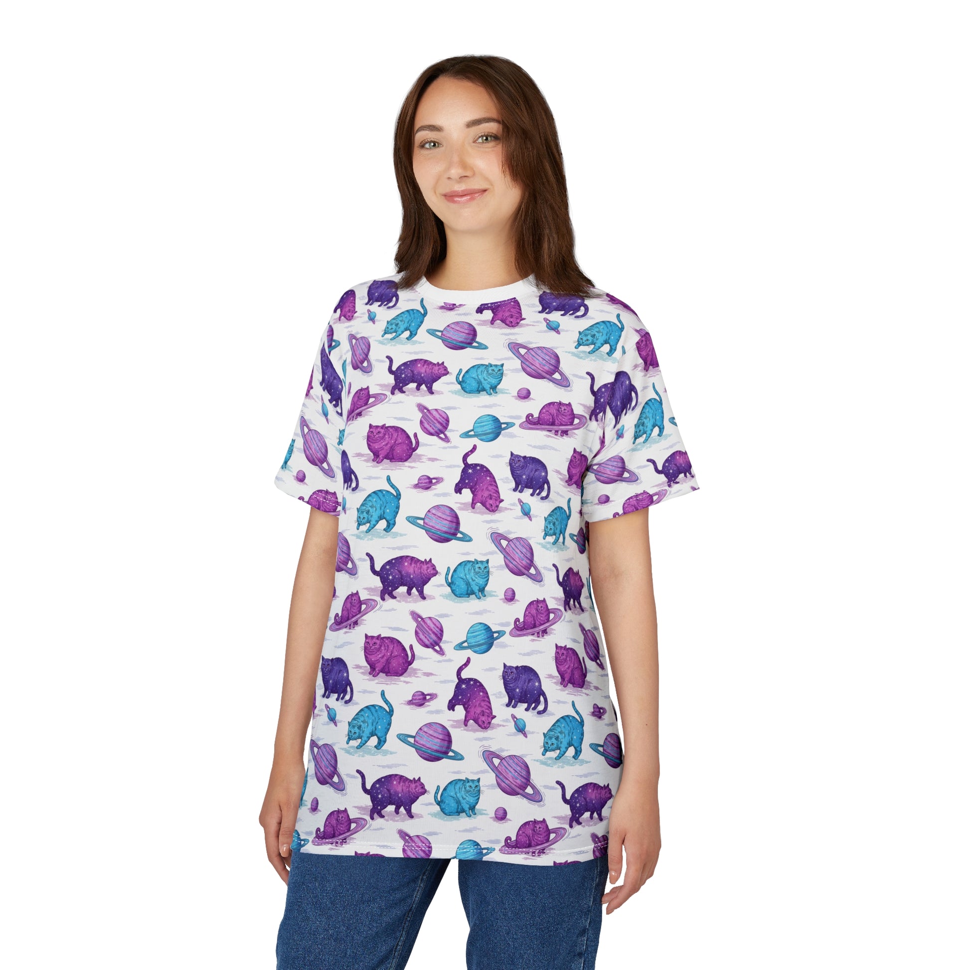 A woman modeling a white short-sleeve t-shirt with an all-over print of purple and blue dinosaur figures, paired with blue jeans, against a plain white background. Funny Chubby Cats Orbiting Planets Graphic T-Shirt for Casual Wear
