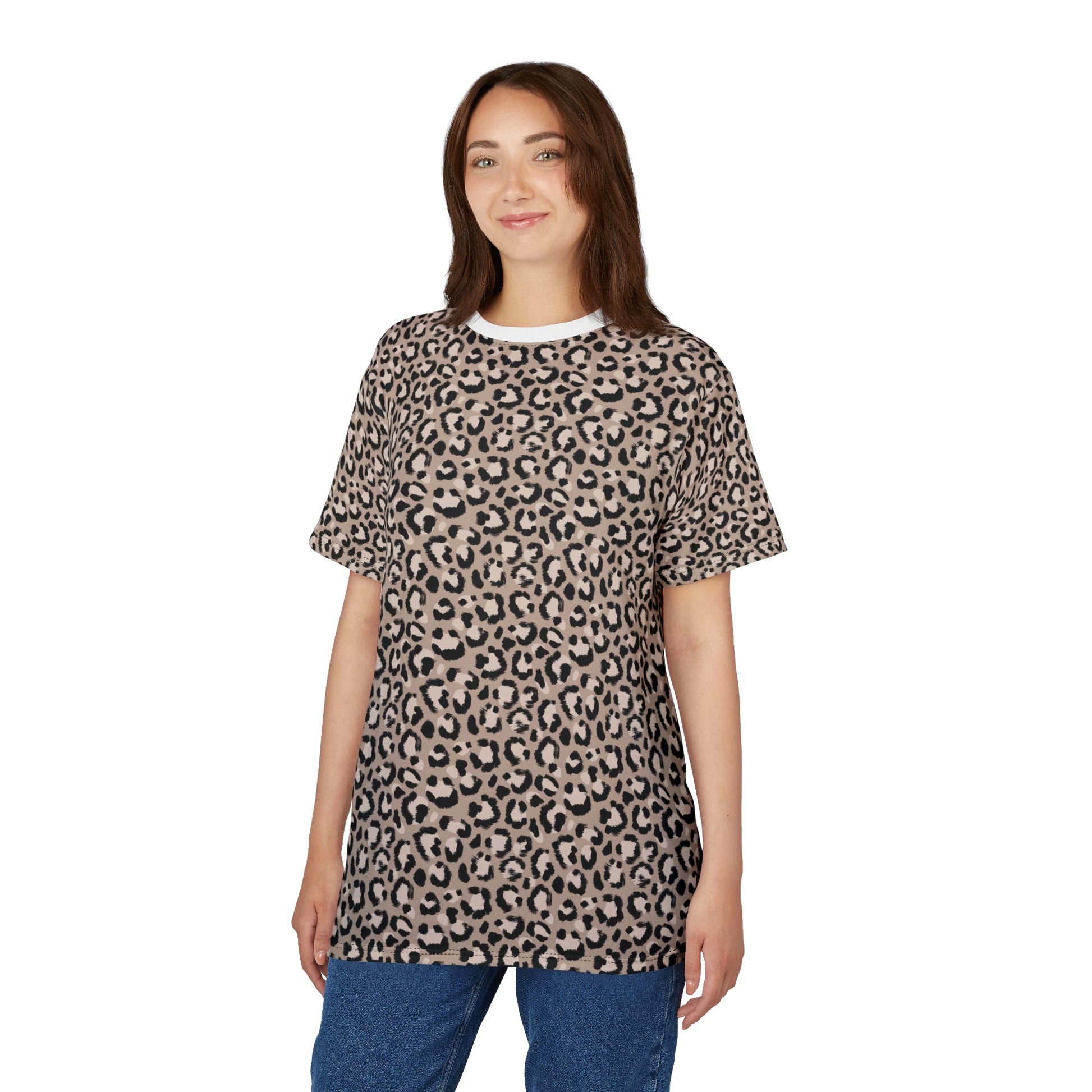 A woman modeling a short-sleeve crewneck t-shirt with a beige and black leopard print pattern, paired with blue jeans, against a plain white background. Funny Comfortable Leopard Print T-Shirt for Casual Wear