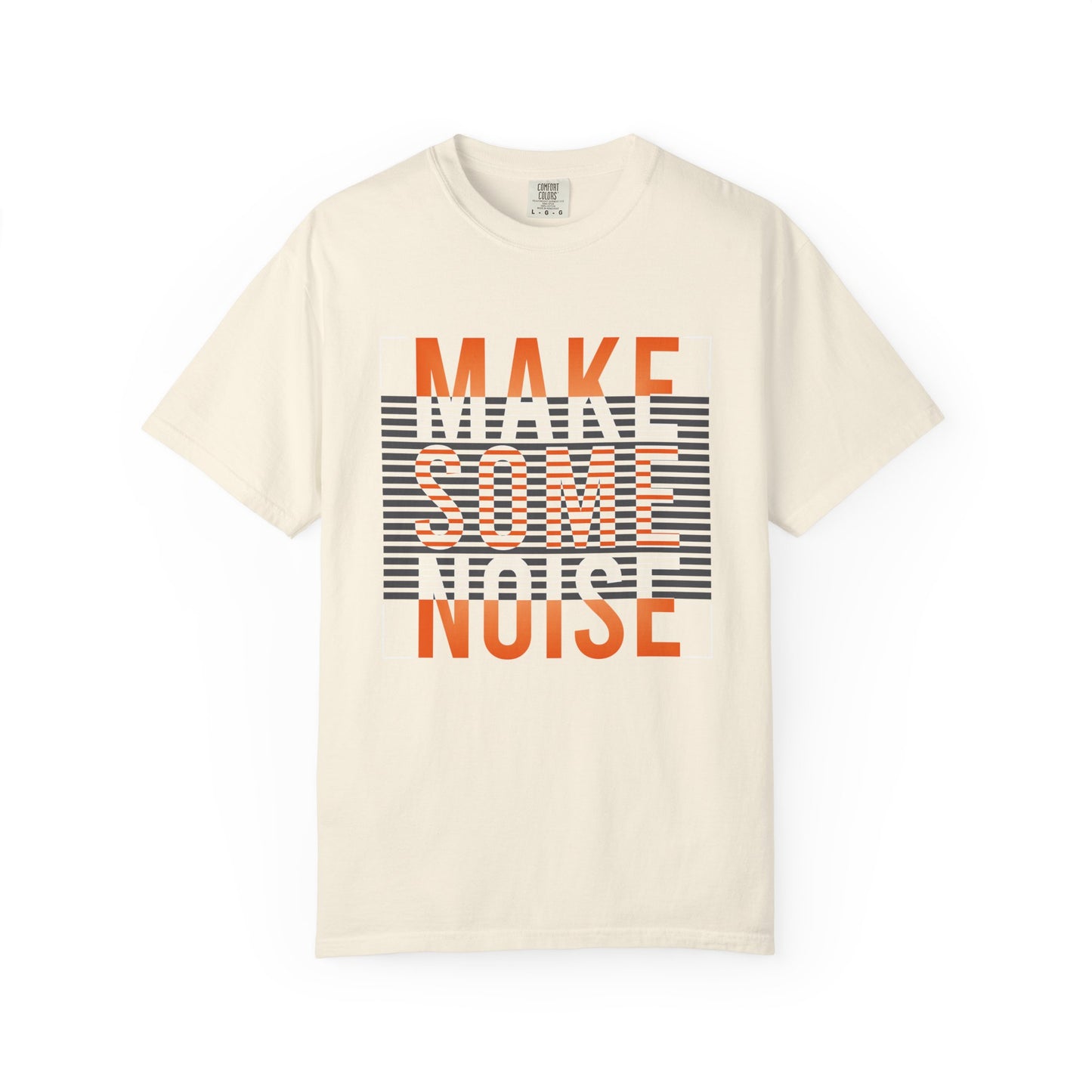 An off-white short-sleeve t-shirt with a graphic print on the front reading 'MAKE SOME NOISE' in orange and white over a black-and-white striped background. Grunge Make Some Noise Slogan Typography Graphic T-Shirt for Casual Wear