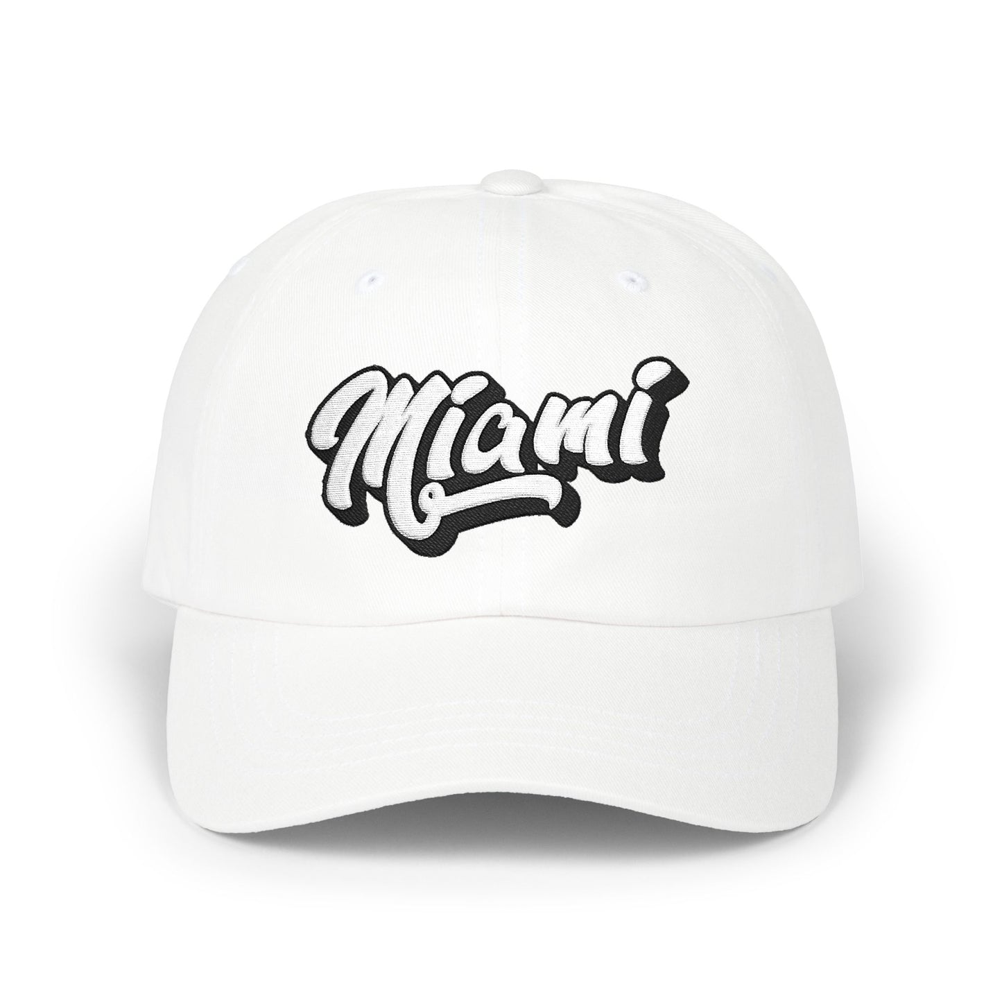 A white baseball cap featuring the word 'Miami' embroidered in a stylized black and white cursive font on the front, set against a clean white background. Minimalist Miami Beach Typography Classic Dad Cap
