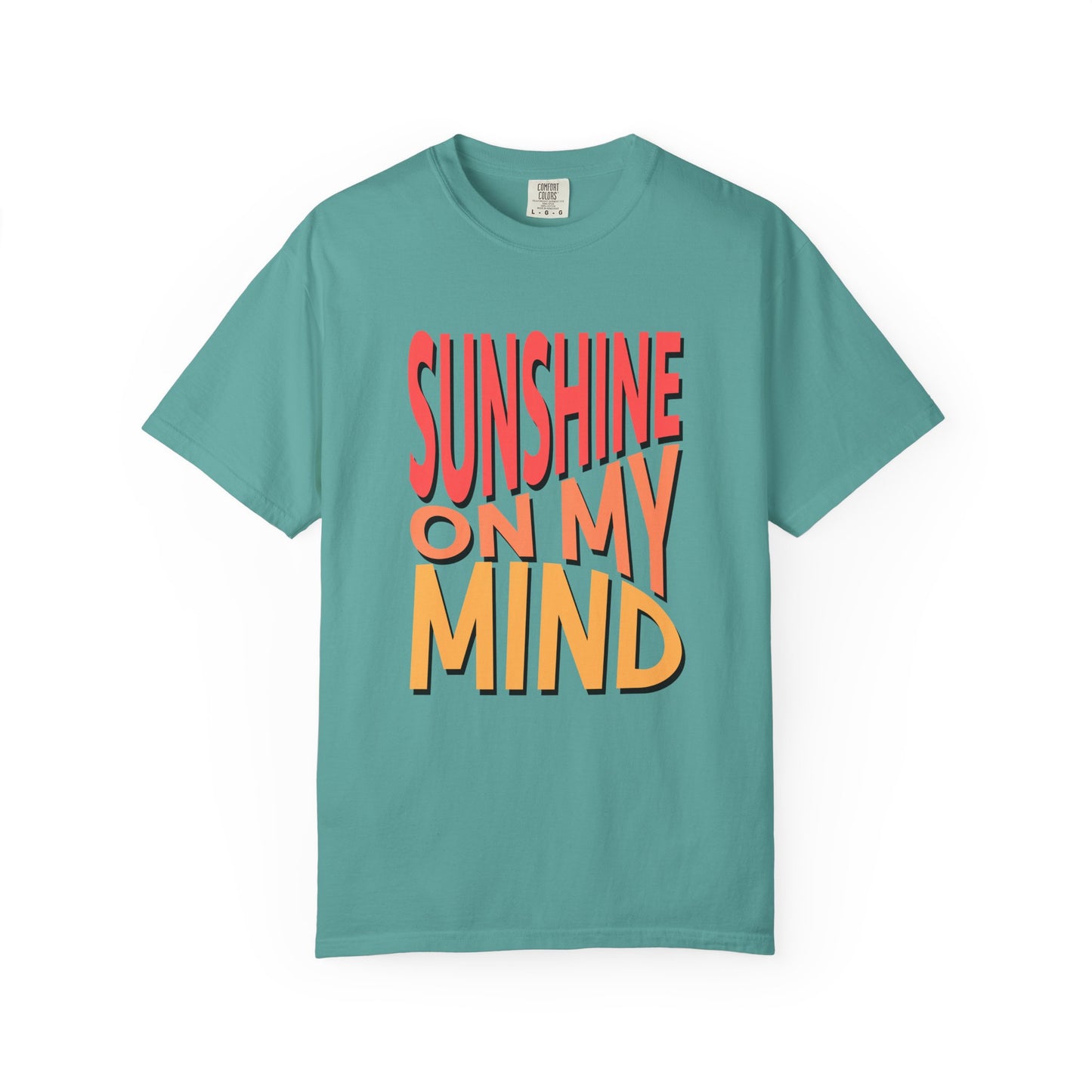 A teal short-sleeve t-shirt with a retro-style graphic text reading 'SUNSHINE ON MY MIND' in coral red and orange-yellow with black drop shadows, displayed on a clean white background. Modern Sunshine On My Mind Summer Vibes Graphic T-Shirt Casual Wear