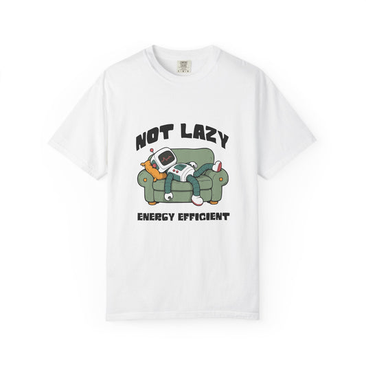 A white short-sleeve crewneck t-shirt featuring a cartoon graphic of a person relaxing on a green couch with a retro computer, with the text 'NOT LAZY ENERGY EFFICIENT' printed in black.