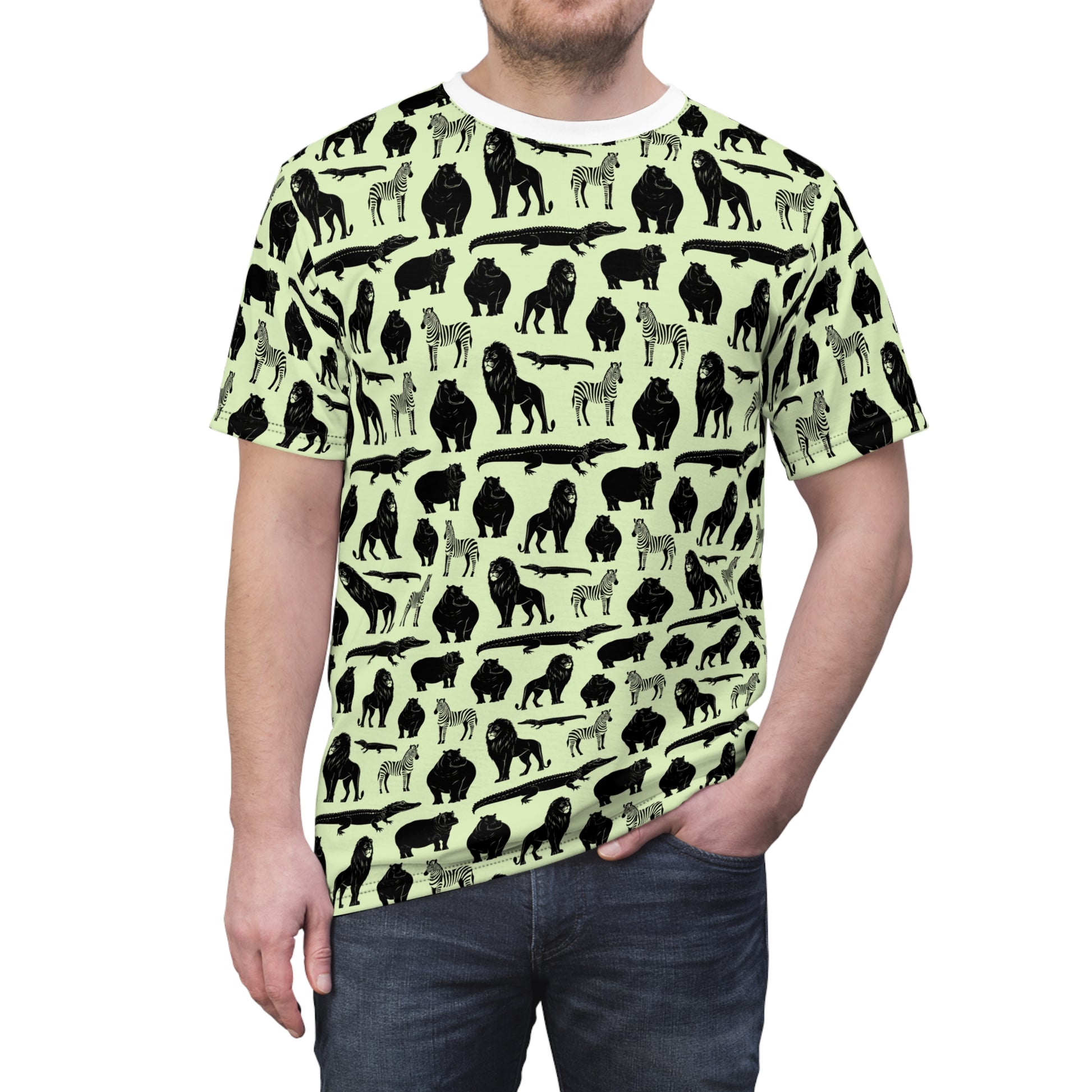 A man wearing a short-sleeve crewneck t-shirt with an all-over animal silhouette print. The shirt features black and gray silhouettes of gorillas, zebras, and crocodiles on a pale yellow-green background. Playful Bold Jungle Safari Animal Pattern T-Shirt for Casual Wear