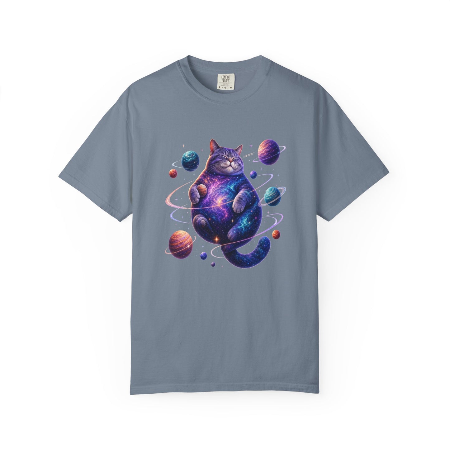 A slate blue crewneck t-shirt featuring a colorful graphic of a cosmic purple cat surrounded by planets, displayed on a clean white background. Playful Celestial Feline: Space-Themed Cat T-Shirt for Casual Wear