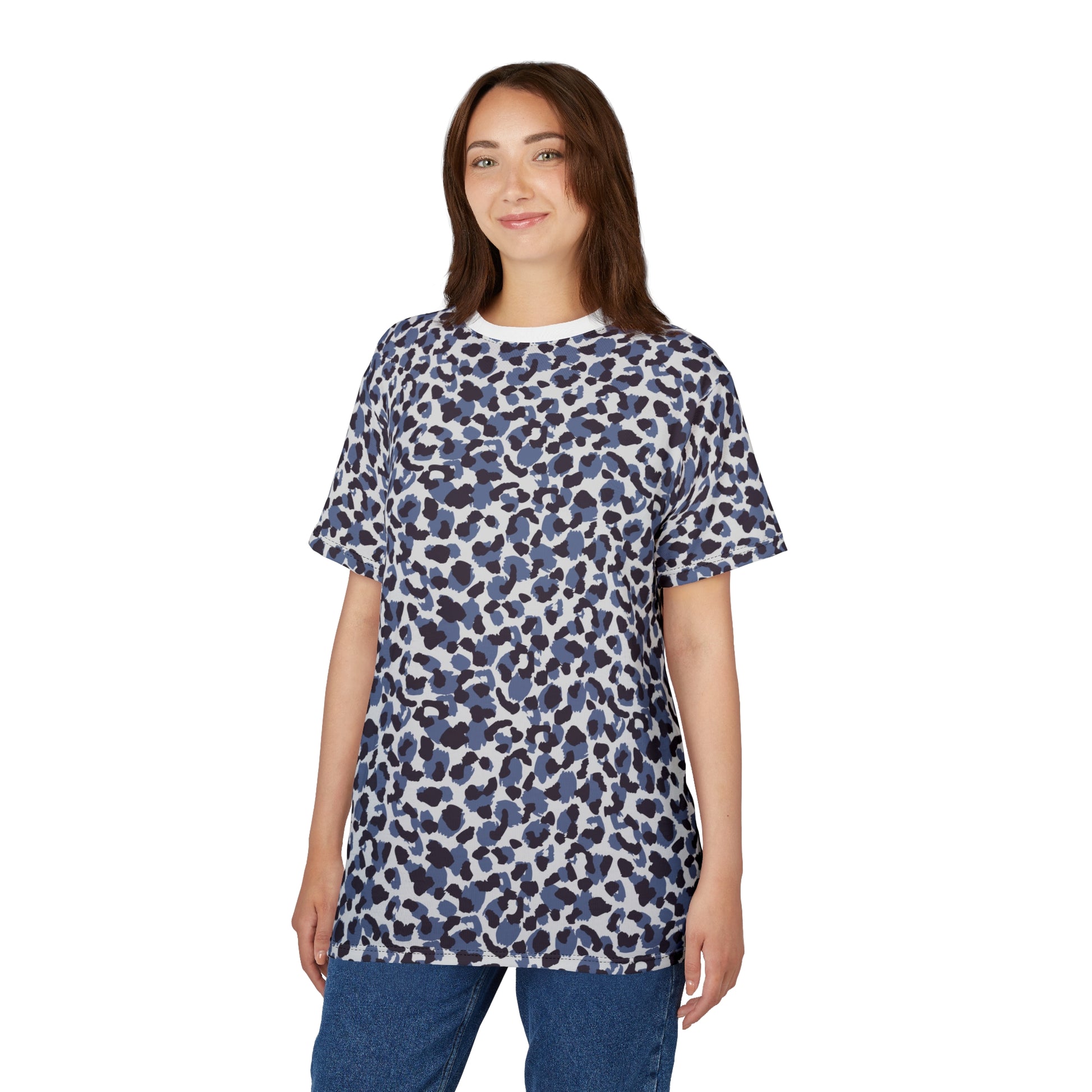 A woman modeling a short-sleeve crewneck t-shirt with a blue, navy, and white abstract organic pattern, paired with blue jeans against a solid white background. Retro Bold Blue Leopard Print T-Shirt for Casual Wear