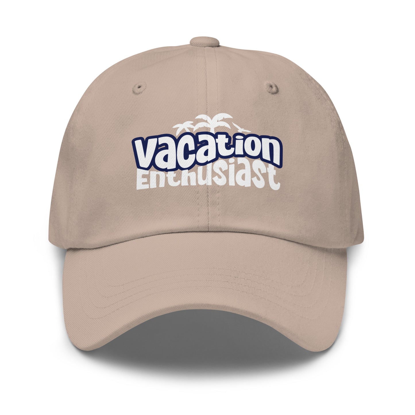 A beige baseball cap with a curved brim, featuring a 'vacation Enthusiast' graphic on the front in blue and white with a small palm tree motif, set against a plain white background. Retro Vacation Enthusiast Bold Graphic Classic Dad Cap for Casual Wear