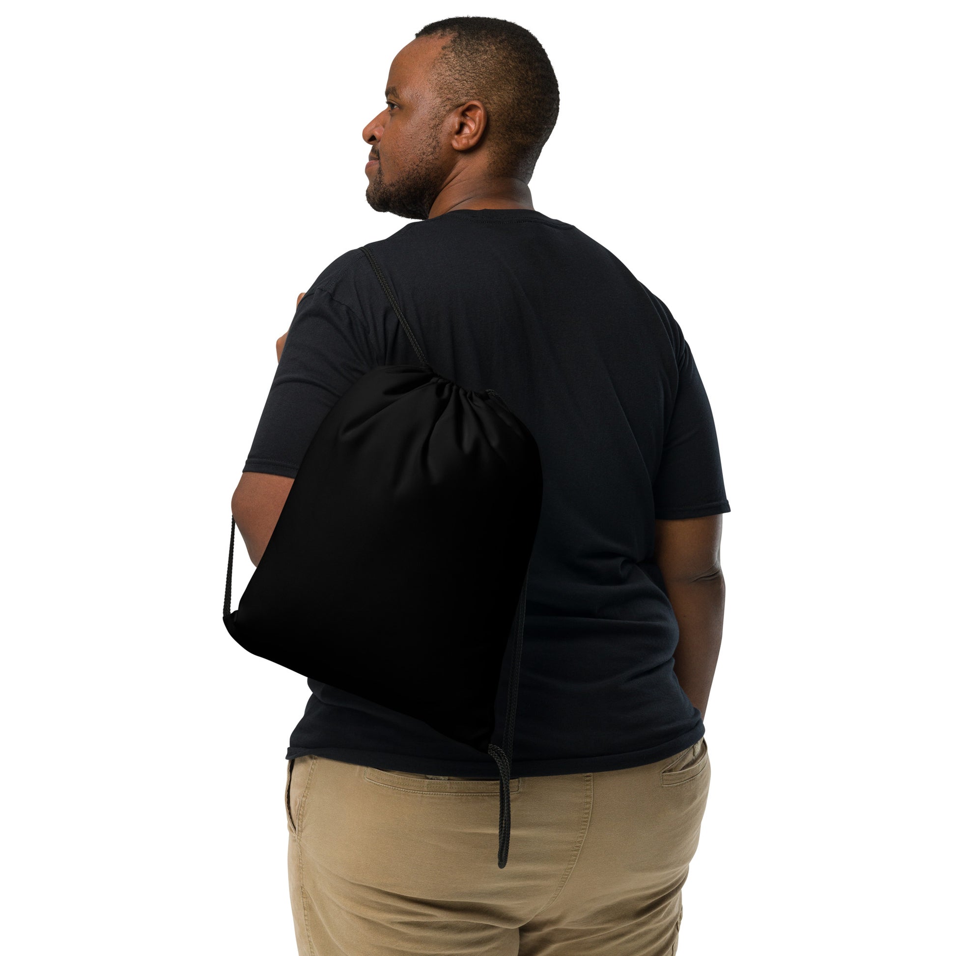 Man wearing a black drawstring bag over his shoulder on a white background Sleek Minimalist Solid Black Lightweight Drawstring Bag
