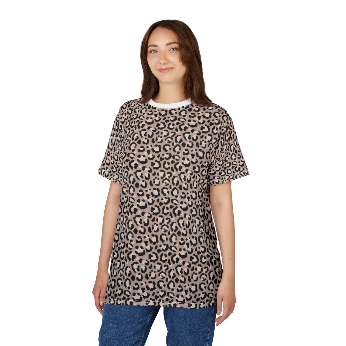A woman modeling a short-sleeve crewneck t-shirt with a beige and black leopard print pattern, paired with blue jeans, against a plain white background. Trendy Comfortable Leopard Print T-Shirt for Casual Wear