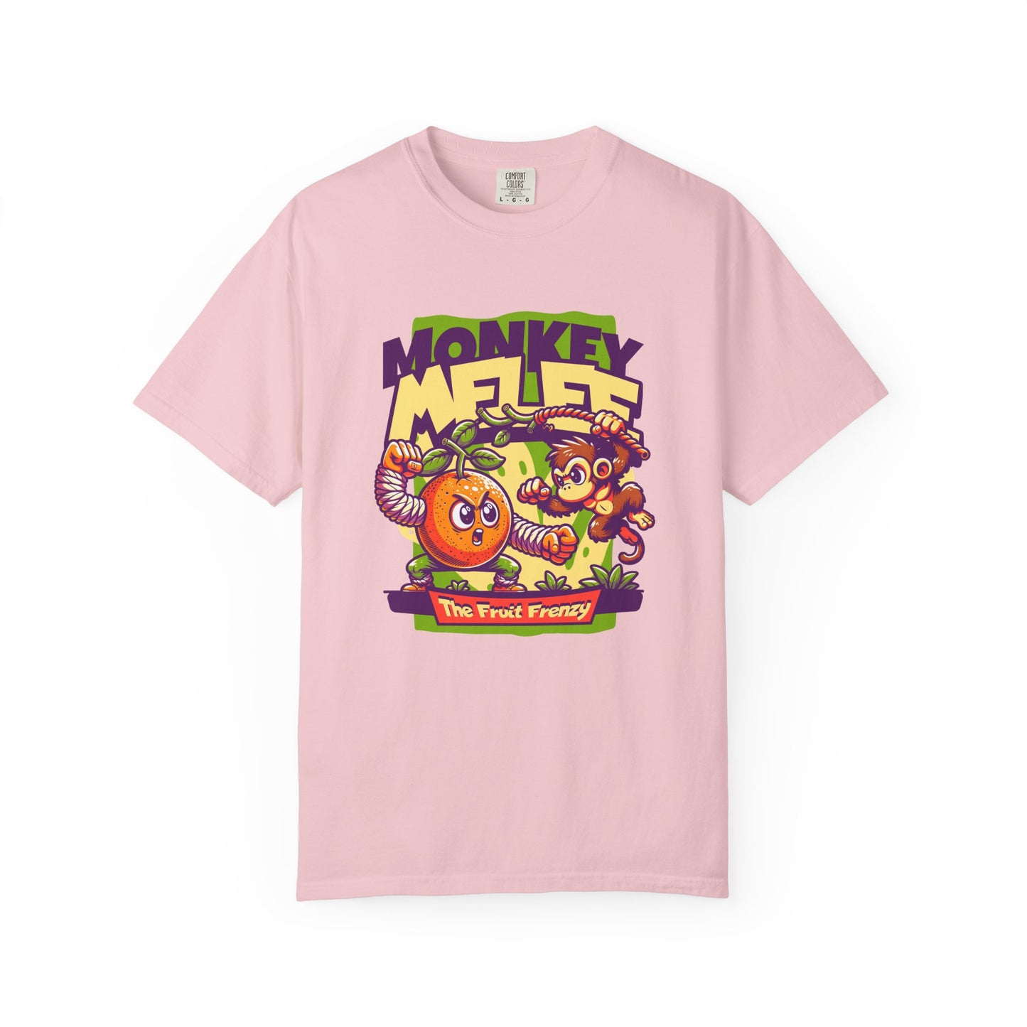 A light pink short-sleeve crewneck t-shirt featuring a colorful cartoon graphic of a monkey and an orange with the text 'MONKEY MELEE' and 'The Fruit Frenzy'. Tropical Fruit Frenzy T-Shirt Collection