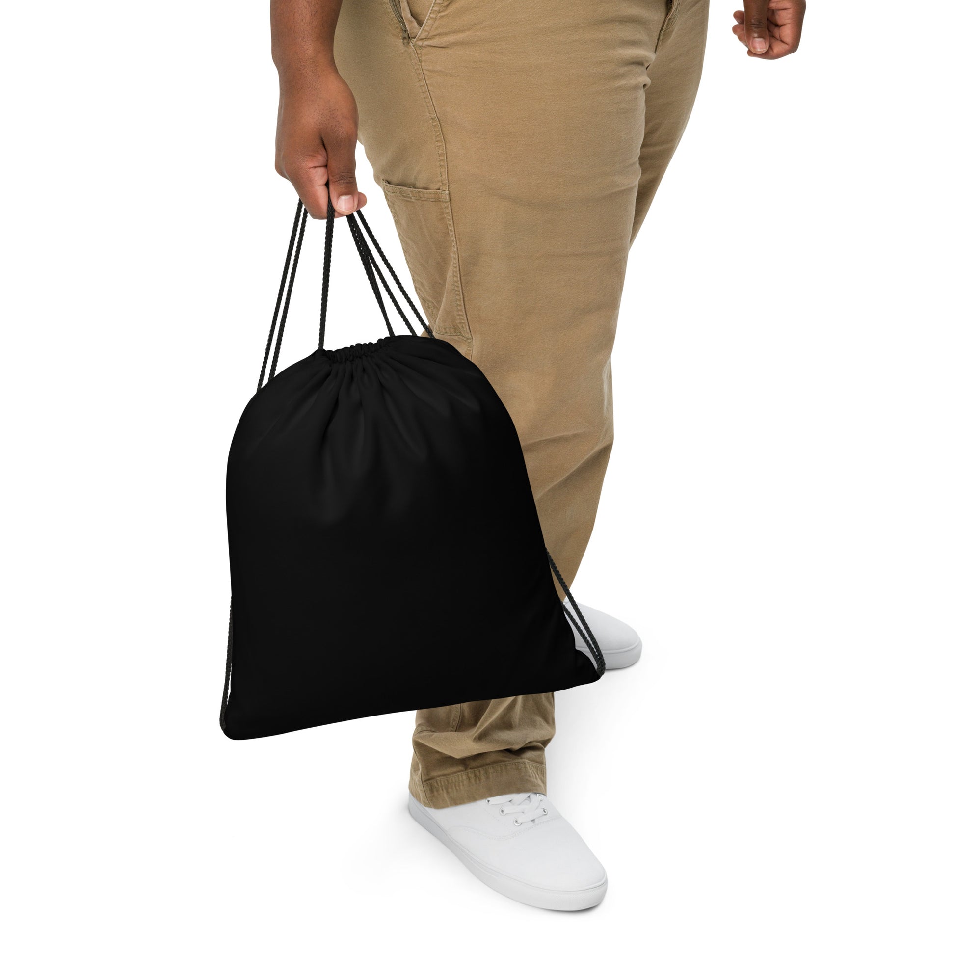 Person holding a black drawstring bag on a white background Unique Minimalist Solid Black Lightweight Drawstring Bag
