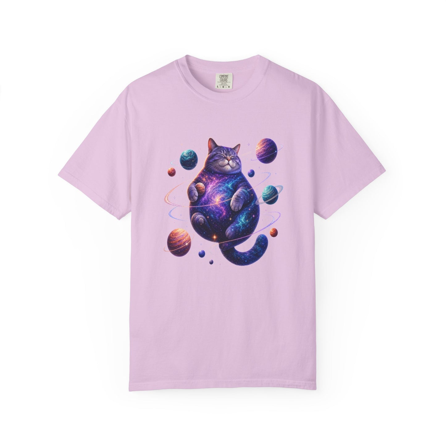 A light purple short-sleeve crewneck t-shirt featuring a colorful graphic of a cosmic cat sitting inside a galaxy, surrounded by planets, on a solid white background. Vibrant Celestial Feline: Space-Themed Cat T-Shirt for Casual Wear