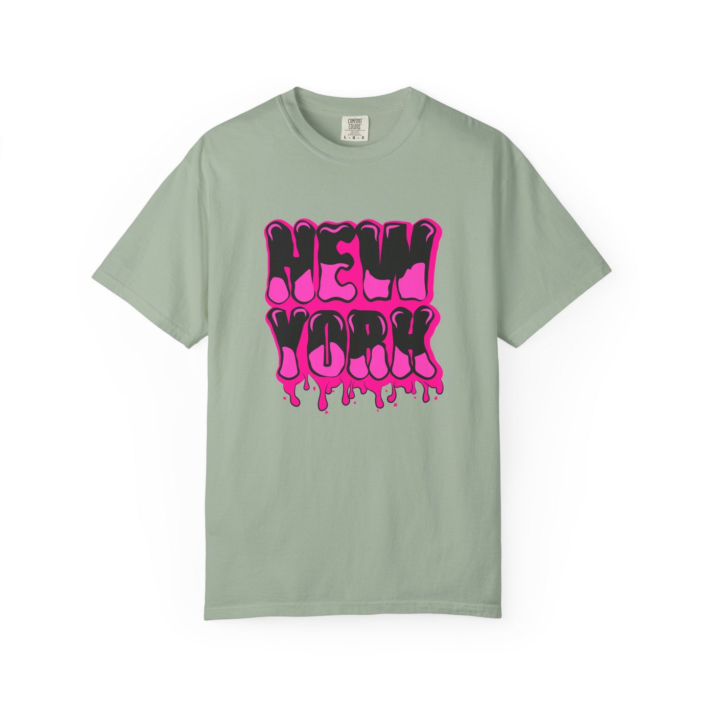 A sage green short-sleeve t-shirt with a vibrant pink and black dripping 'NEW YORK' graphic on the front, displayed against a clean white background. Vintage Bold Graffiti Lettering New York Typography T-Shirt for Casual Wear