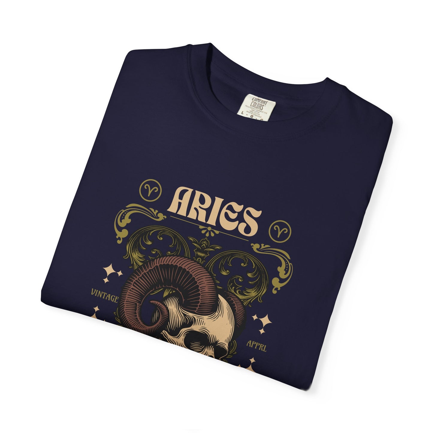 A folded black t-shirt with a vintage-style Aries zodiac graphic featuring a ram skull, ornate gold and beige scrollwork, and the word 'ARIES' on a white background.