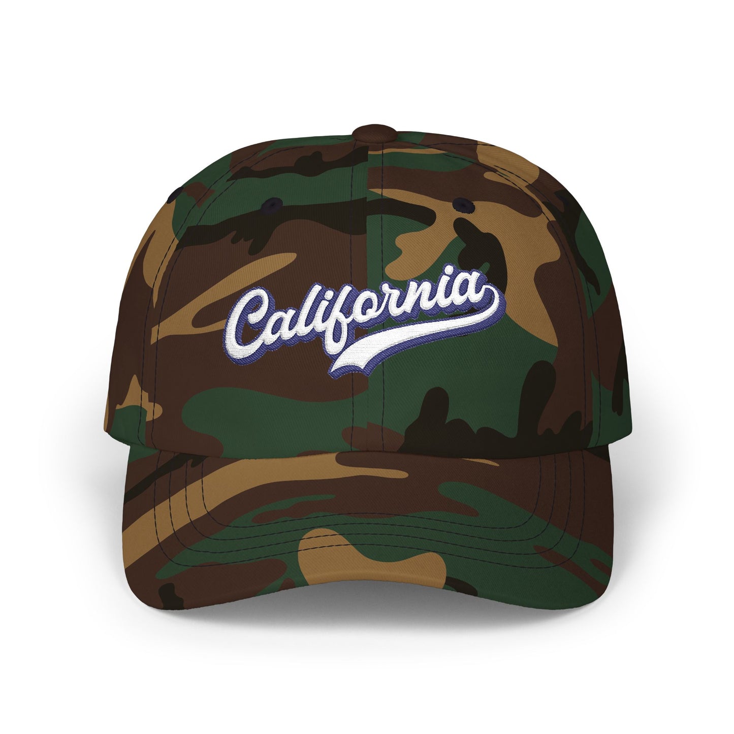 A structured baseball cap in a classic woodland camouflage pattern, featuring 'California' embroidered in white script with a blue outline on the front panel. Vintage California Typography Embroidered Classic Dad Cap