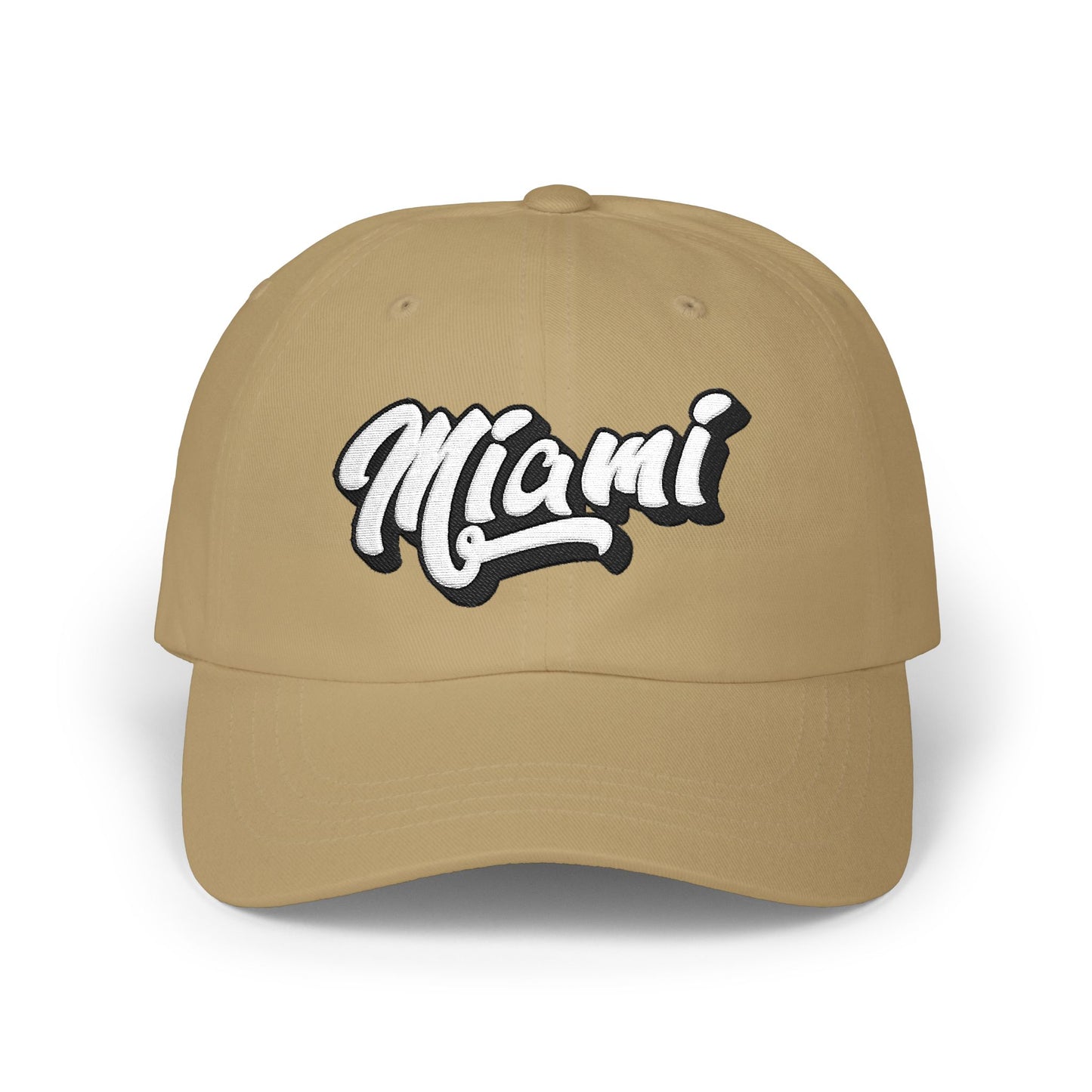 A tan baseball cap featuring the word 'Miami' in a stylized white script with a black outline on the front panel, set against a plain white background. Vintage Minimalist Miami Beach Typography Classic Dad Cap
