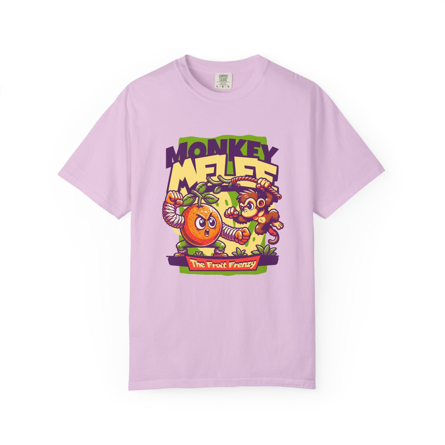 A light purple short-sleeve t-shirt with a colorful cartoon graphic on the front featuring the text 'MONKEY MELEE' and 'The Fruit Frenzy' with an orange, a monkey, and tropical fruits. Whimsical Monkey and Fruit T-Shirt Design