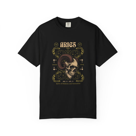 A black short-sleeve crewneck t-shirt featuring a detailed Aries zodiac graphic on the chest. The graphic depicts a ram skull with curved horns, surrounded by ornate gold and beige filigree, stars, and the word 'ARIES' at the top.
