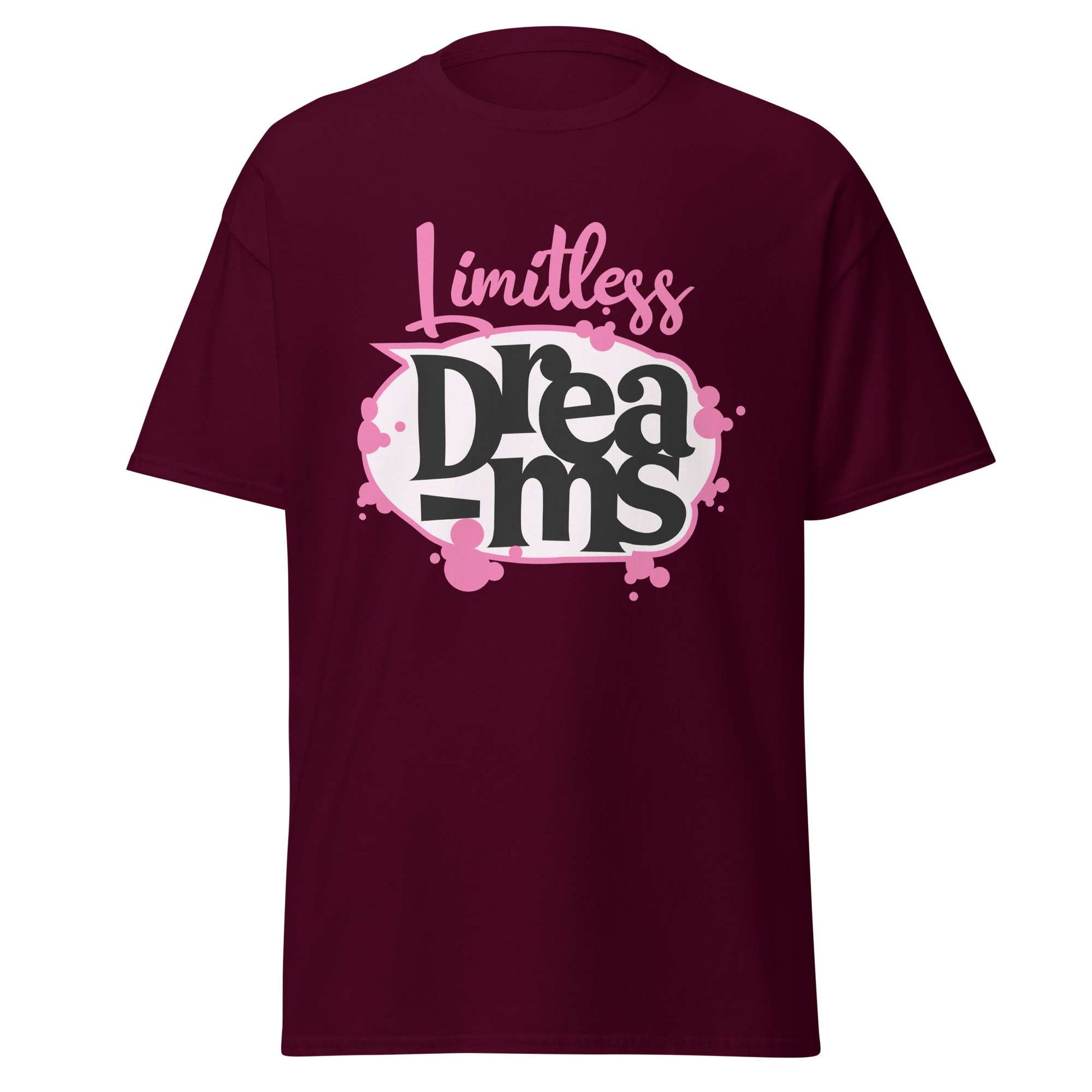 A maroon short-sleeve t-shirt with a graphic on the chest that reads 'Limitless Dreams' in pink and black lettering with a white and pink paint-splatter background, shown on a plain white background. Motivational Quote Limitless Dreams T-Shirt Casual Wear Shop the Motivational Quote Limitless Dreams T-Shirt Casual Wear design, made for everyday comfort and bold, uplifting style that inspires confidence.